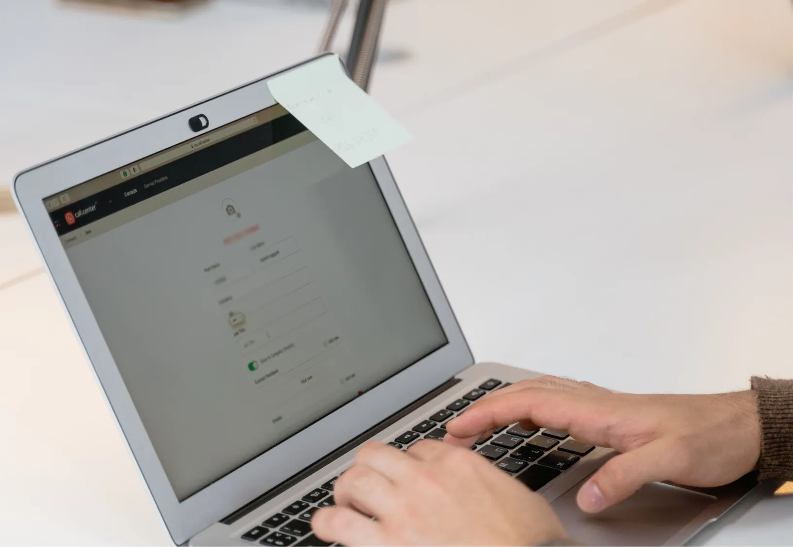 Employee configuring flexible office software settings on a laptop