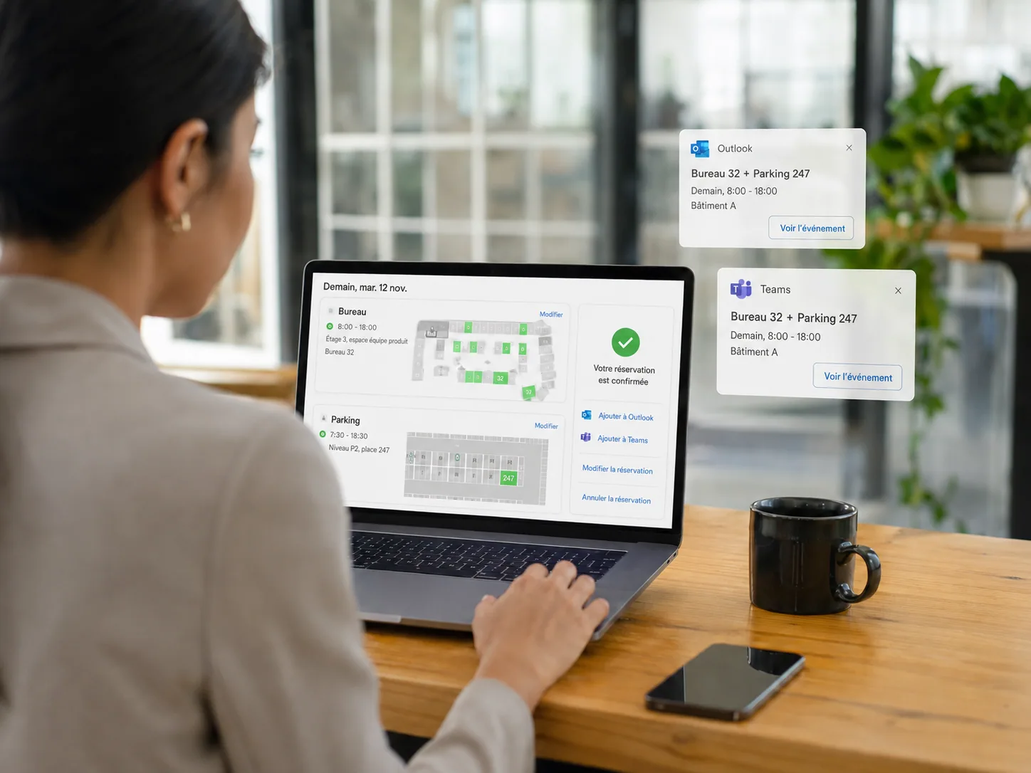 Employee checking the confirmation of her desk and car park space booking, synchronised with Outlook and Teams.