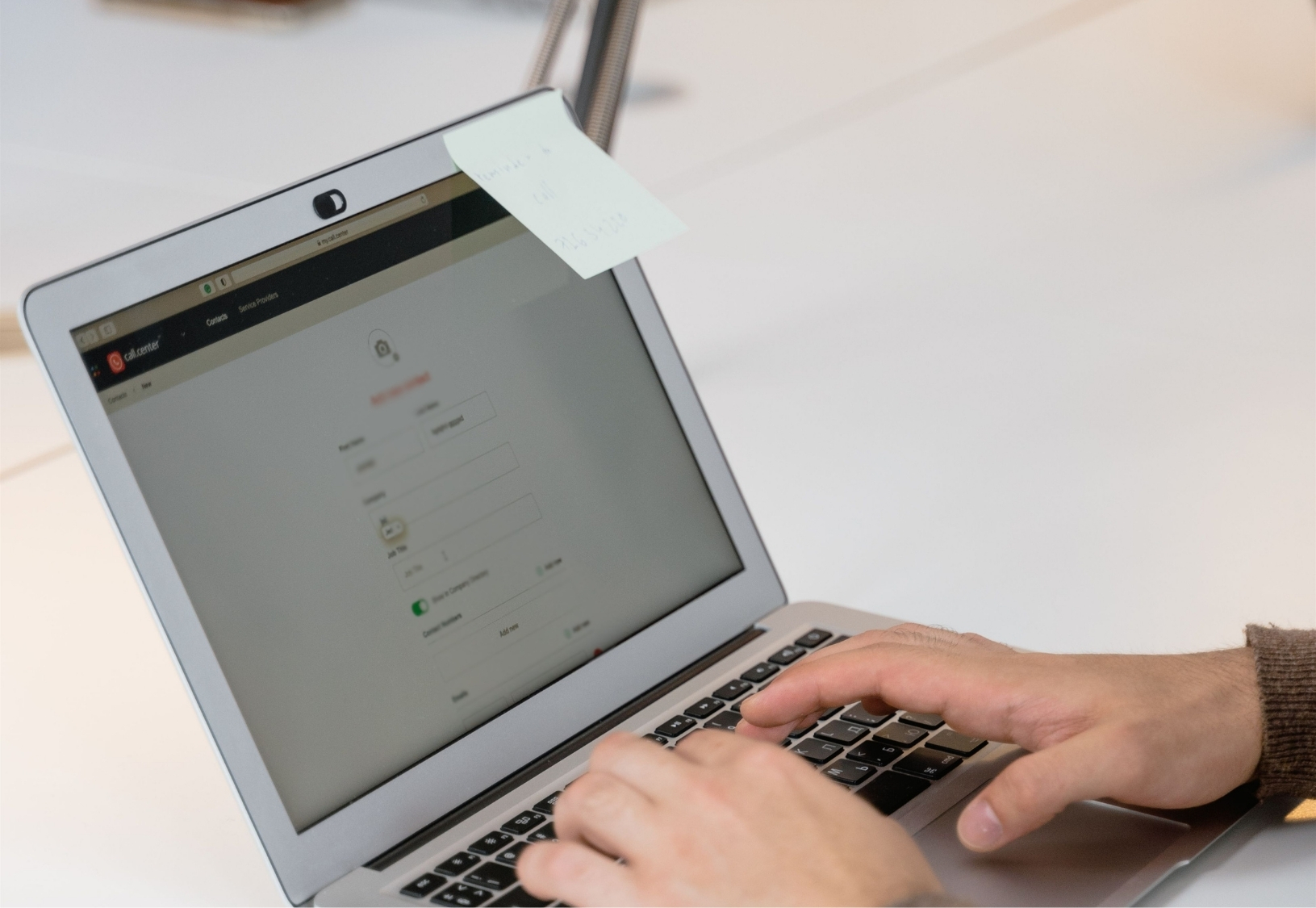 Employee configuring flexible office software settings on a laptop
