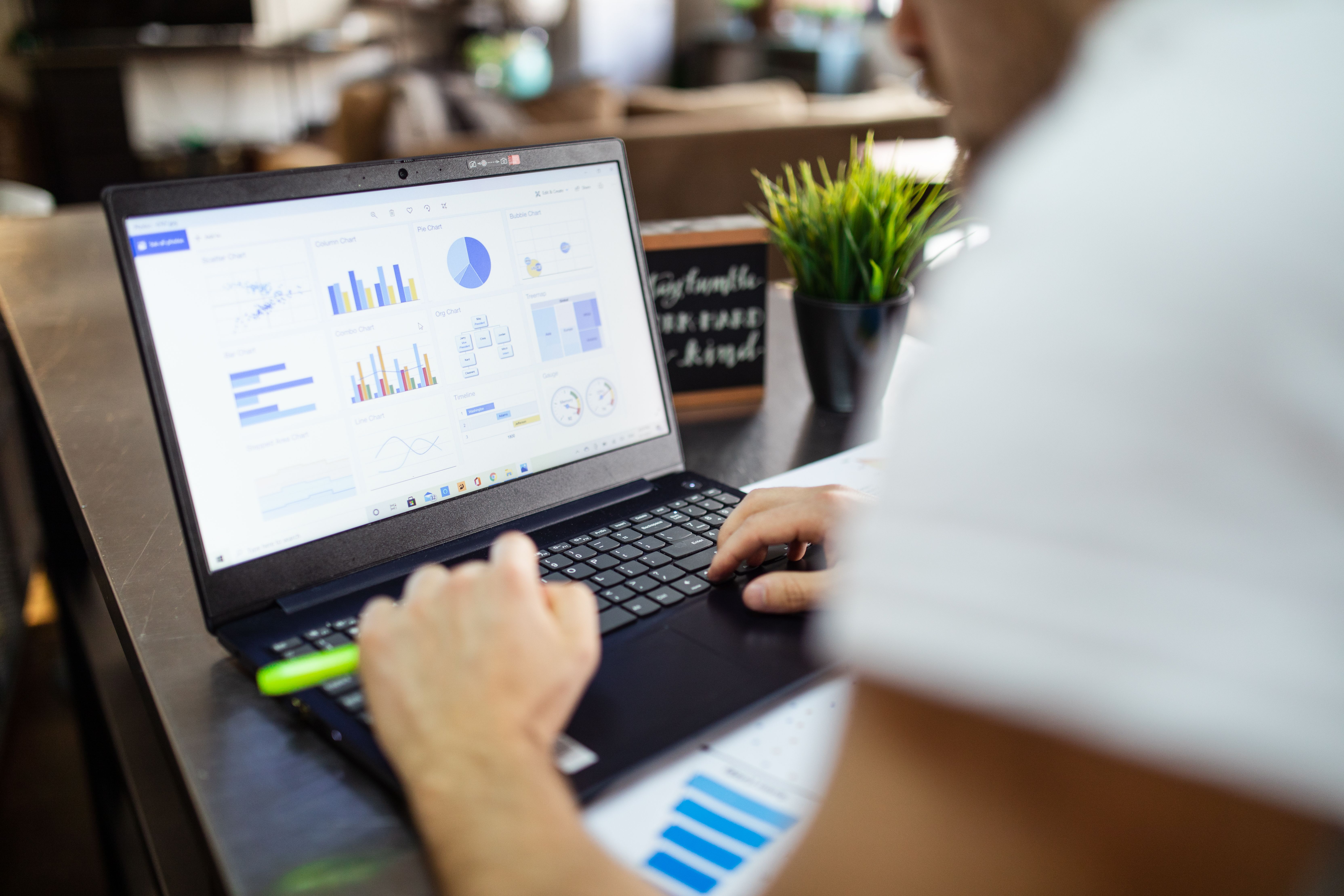 HR data analysis on a tablet showing dashboards and statistical charts